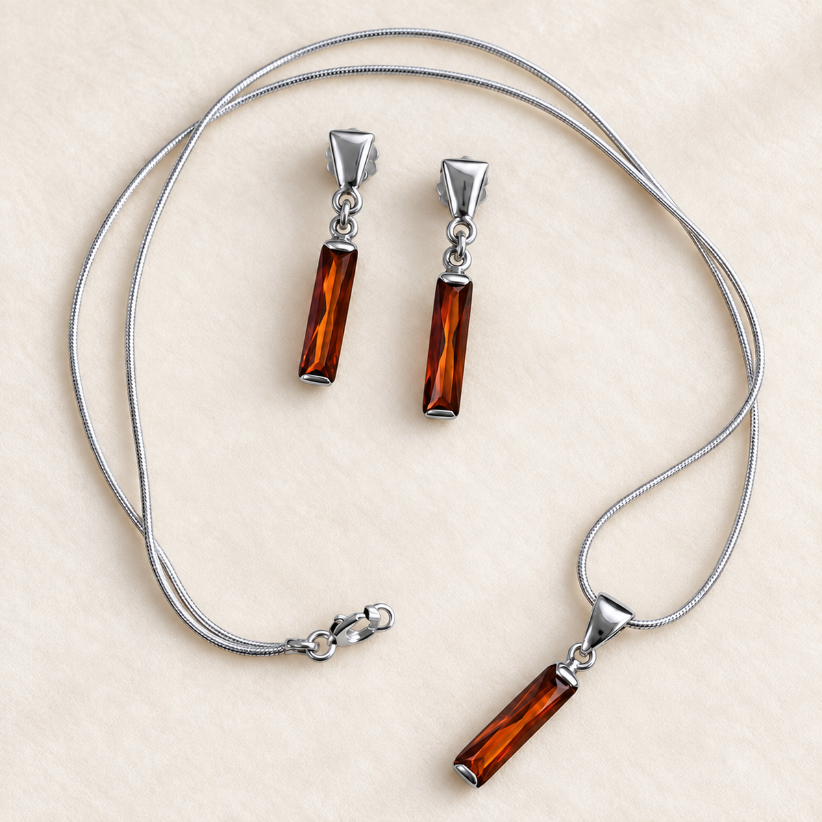 Schmuckset aus 925er und 950er Silber mit orangefarbenen Zirkonia