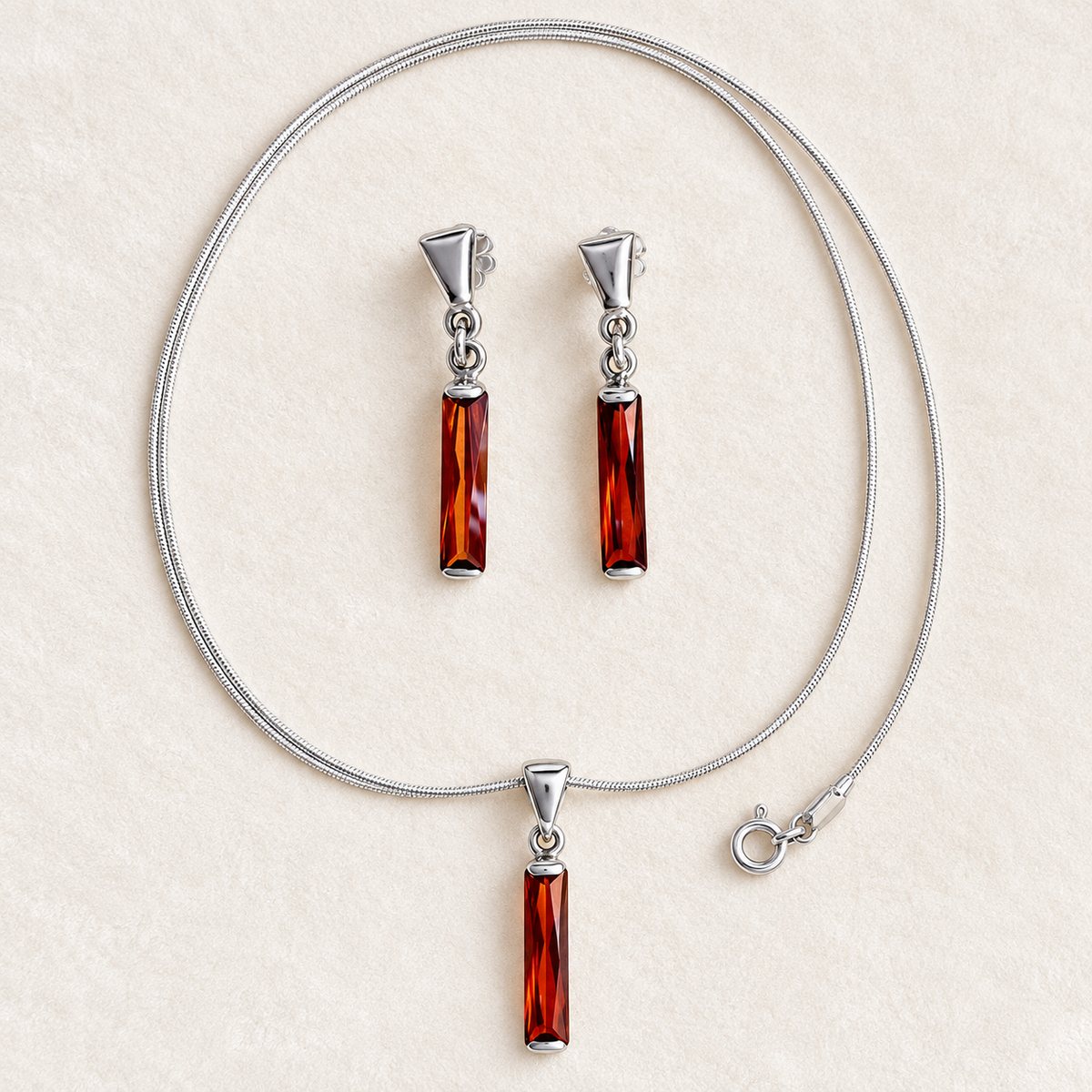 Schmuckset aus 925er und 950er Silber mit orangefarbenen Zirkonia