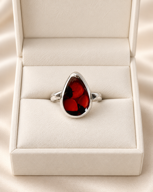 Größenverstellbarer Huayruro-Ring aus 950er Silber